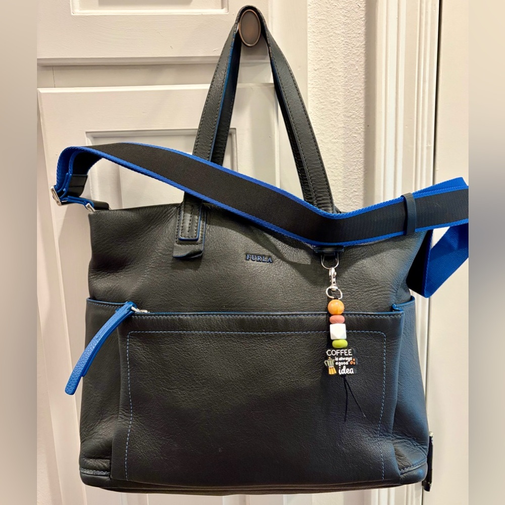 FURLA Black Leather Tote w/Blue Trim & Strap. Your choice of 1 bag charm.
Unisex